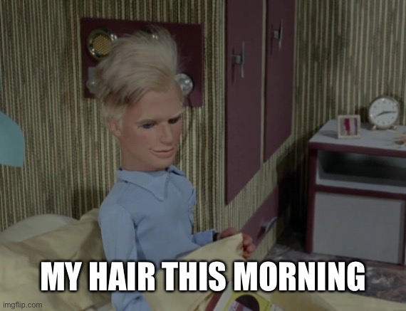John Tracy sits up in bed on Thunderbird 5. Caption is 'My hair this morning'.